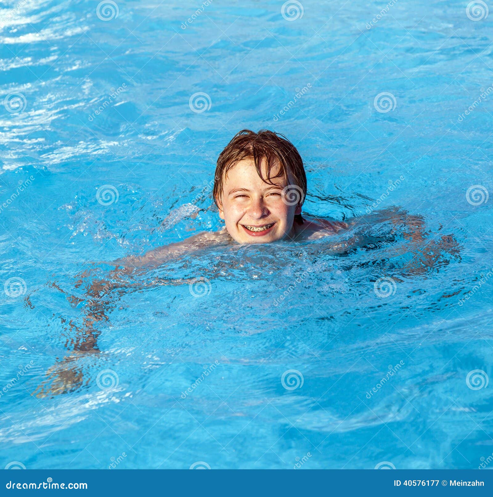 Boy swimming in the pool stock image. Image of handsome 40576177