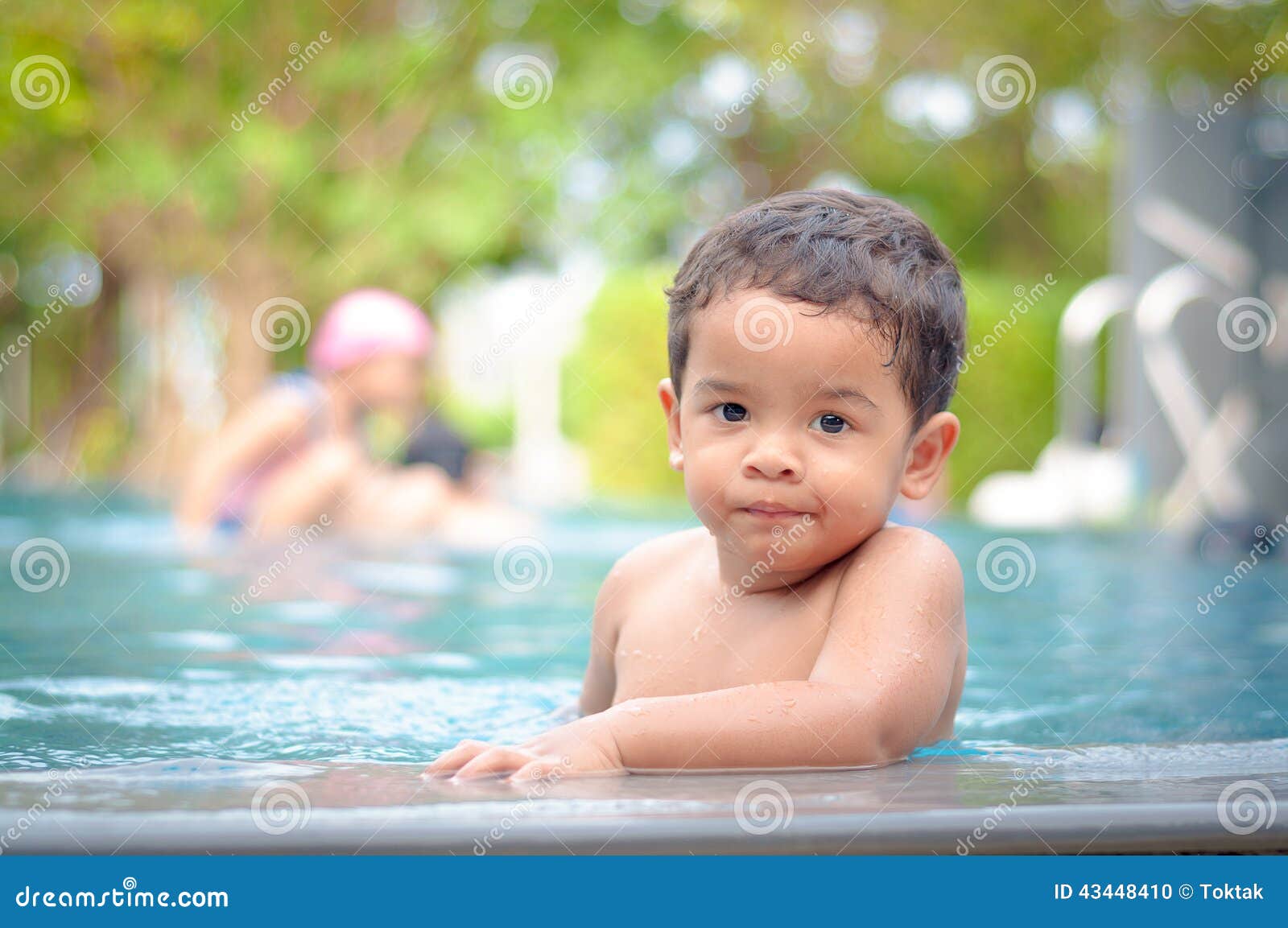 Boy in the swimming pool stock photo. Image of water 43448410