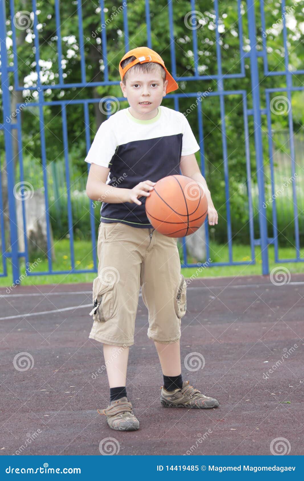 Boy tapping basketball stock image. Image of young, caucasian 14419485