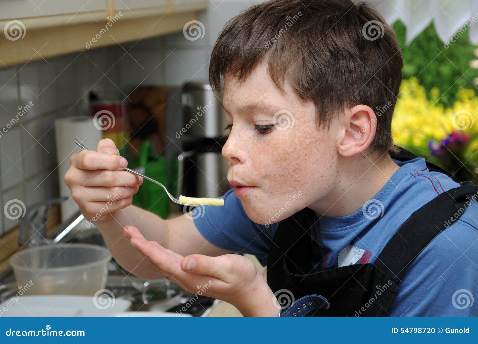 Boy tasting noodles stock photo. Image of dinner, lunch 54798720