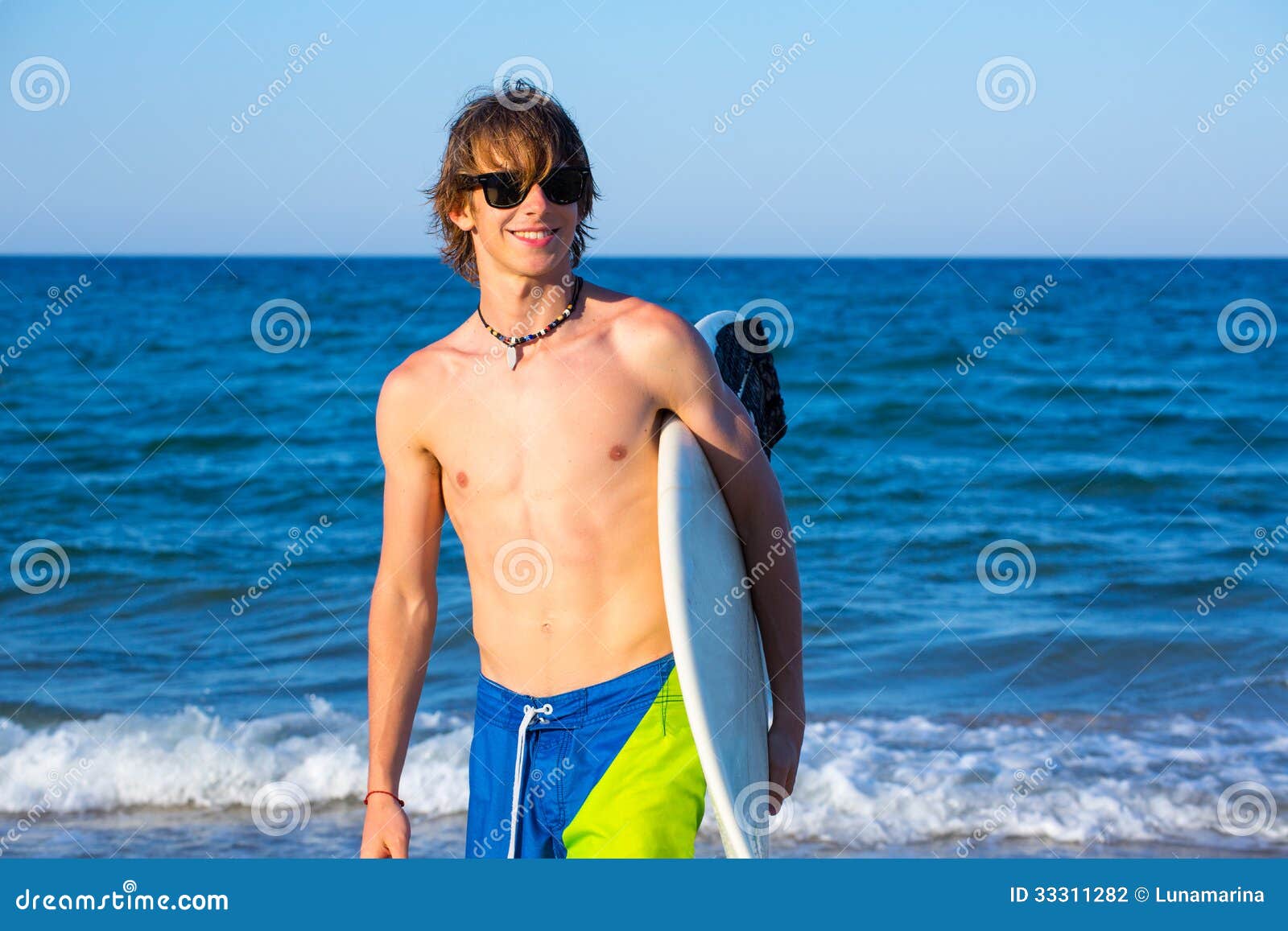 Boy Teen Surfer Happy Holing Surfboard on the Beach Stock Photo - Image ...