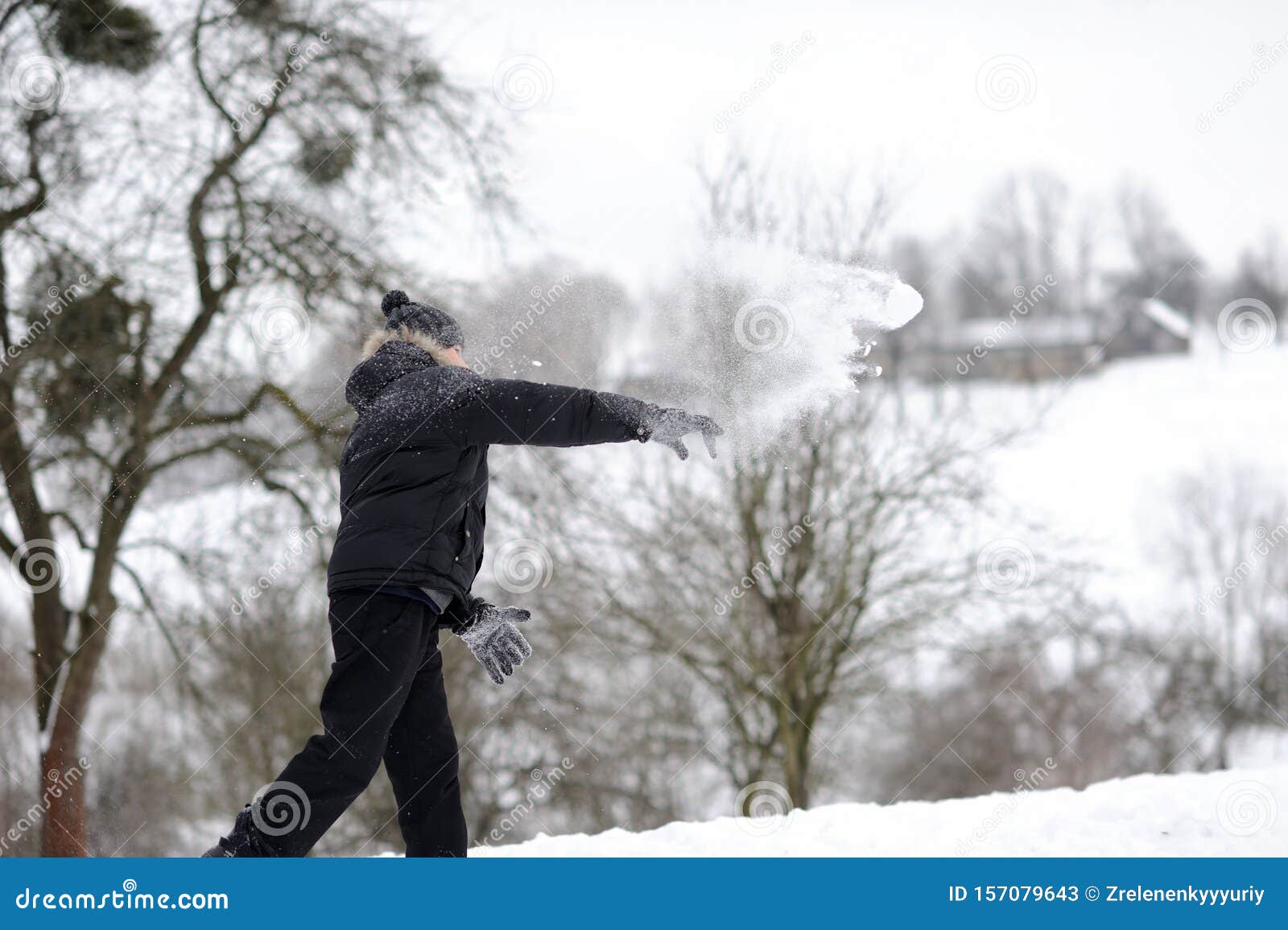 Boy throwing snowballs stock image. Image of beautiful 157079643