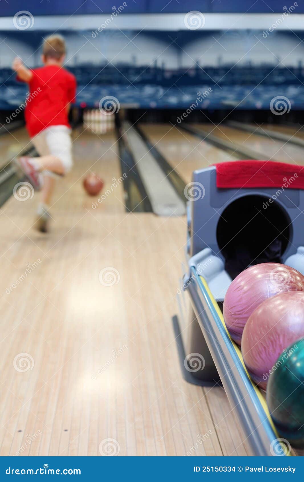 Boy throws ball in bowling stock photo. Image of bowling 25150334
