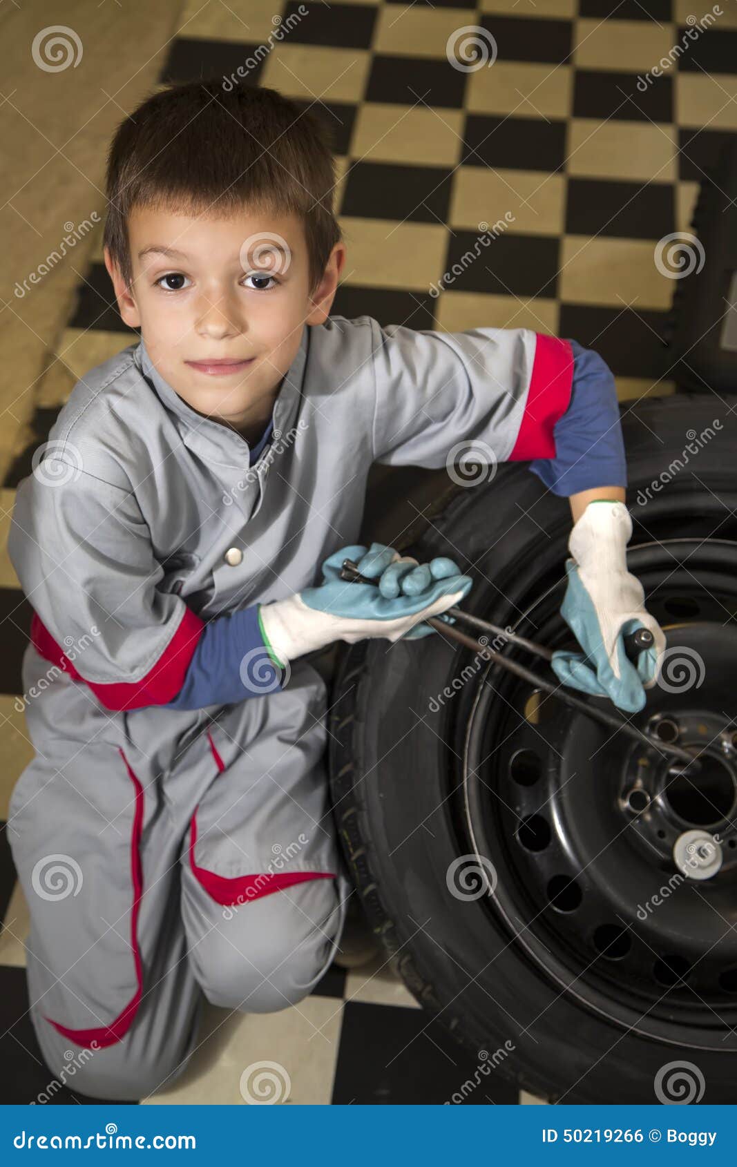 Boy and tires stock photo. Image of transportation, mechanical 50219266