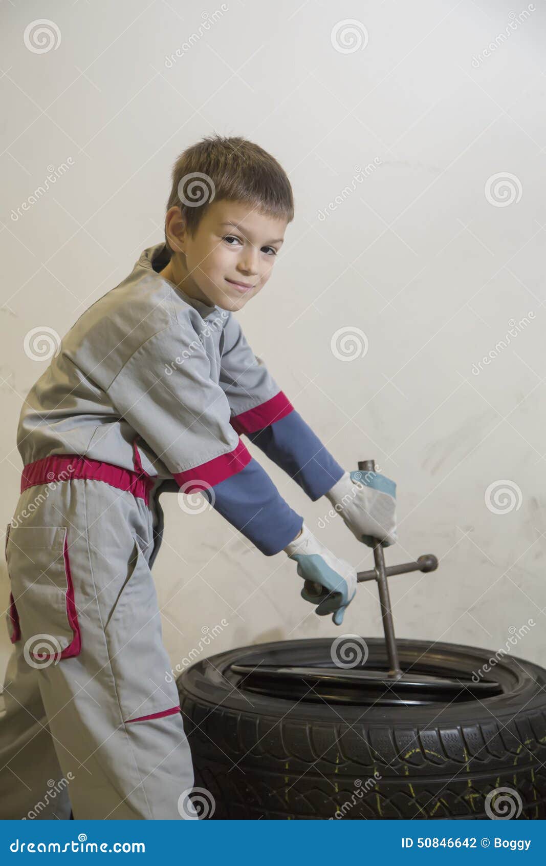 Boy and tires stock photo. Image of tire, transportation 50846642