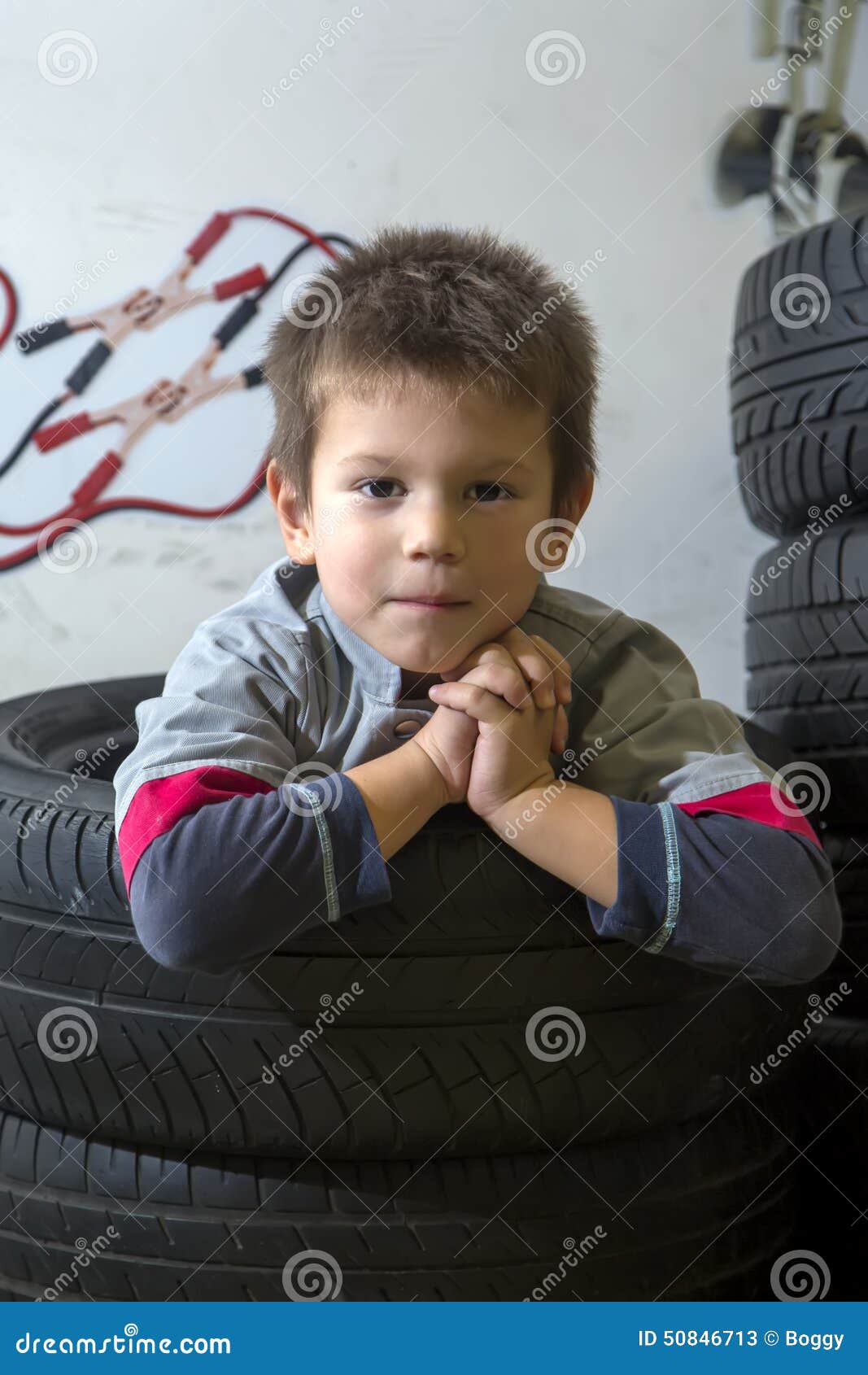 Boy and tires stock image. Image of mechanical, transportation 50846713