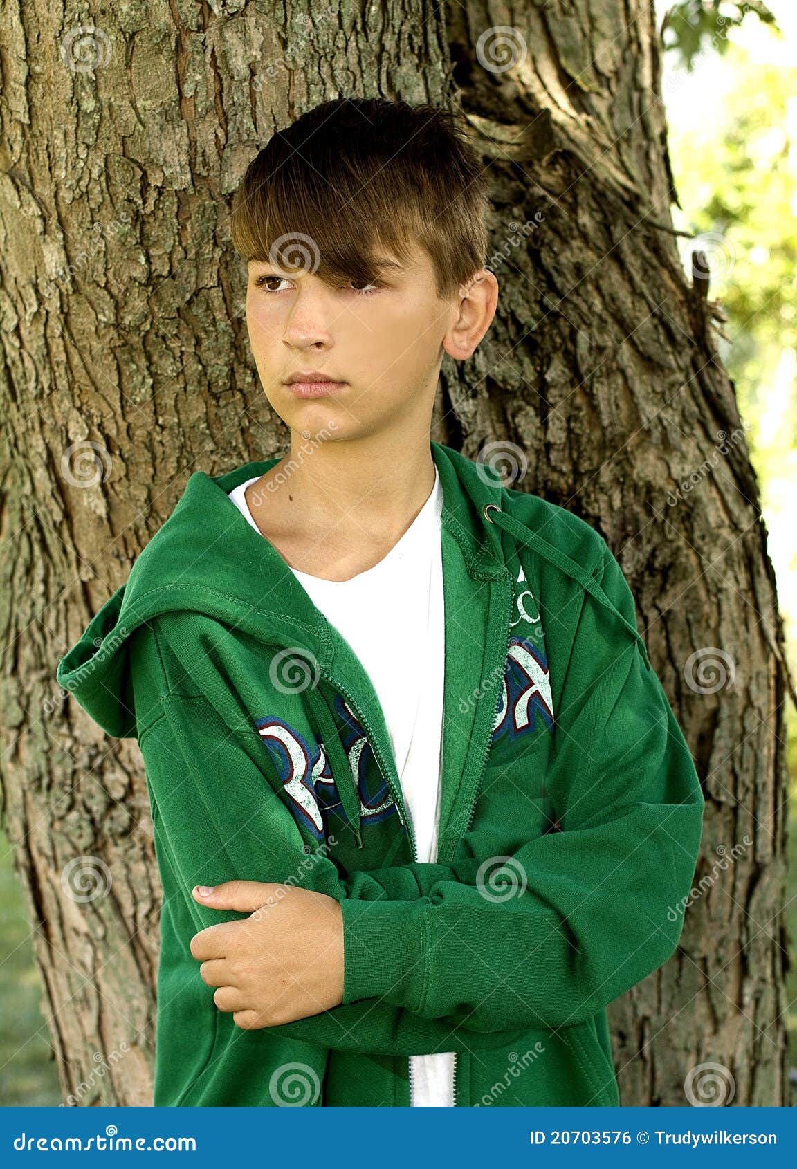 Boy by Tree stock photo. Image of hoodie, thinking, teenager - 20703576