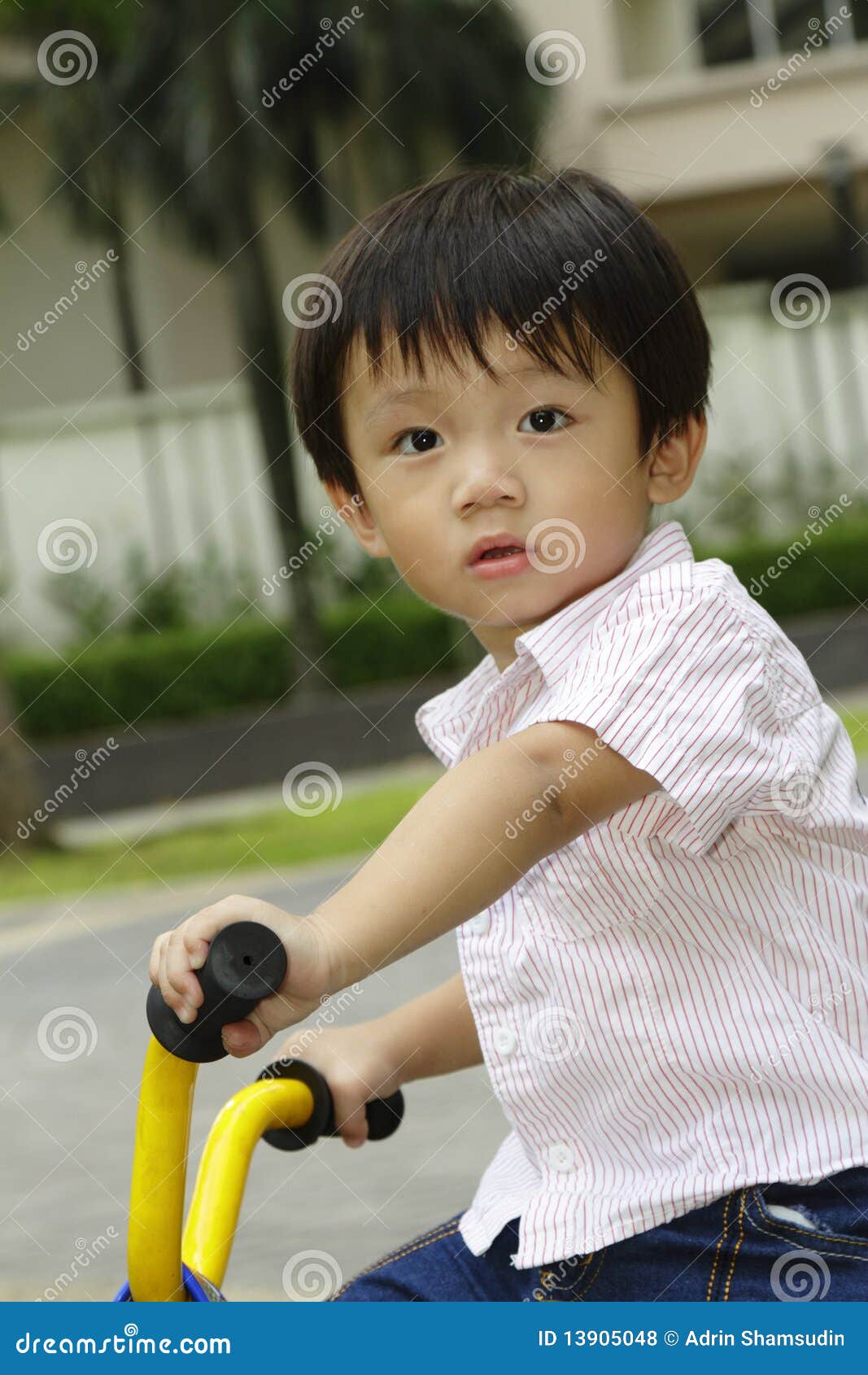 boy on tricycle