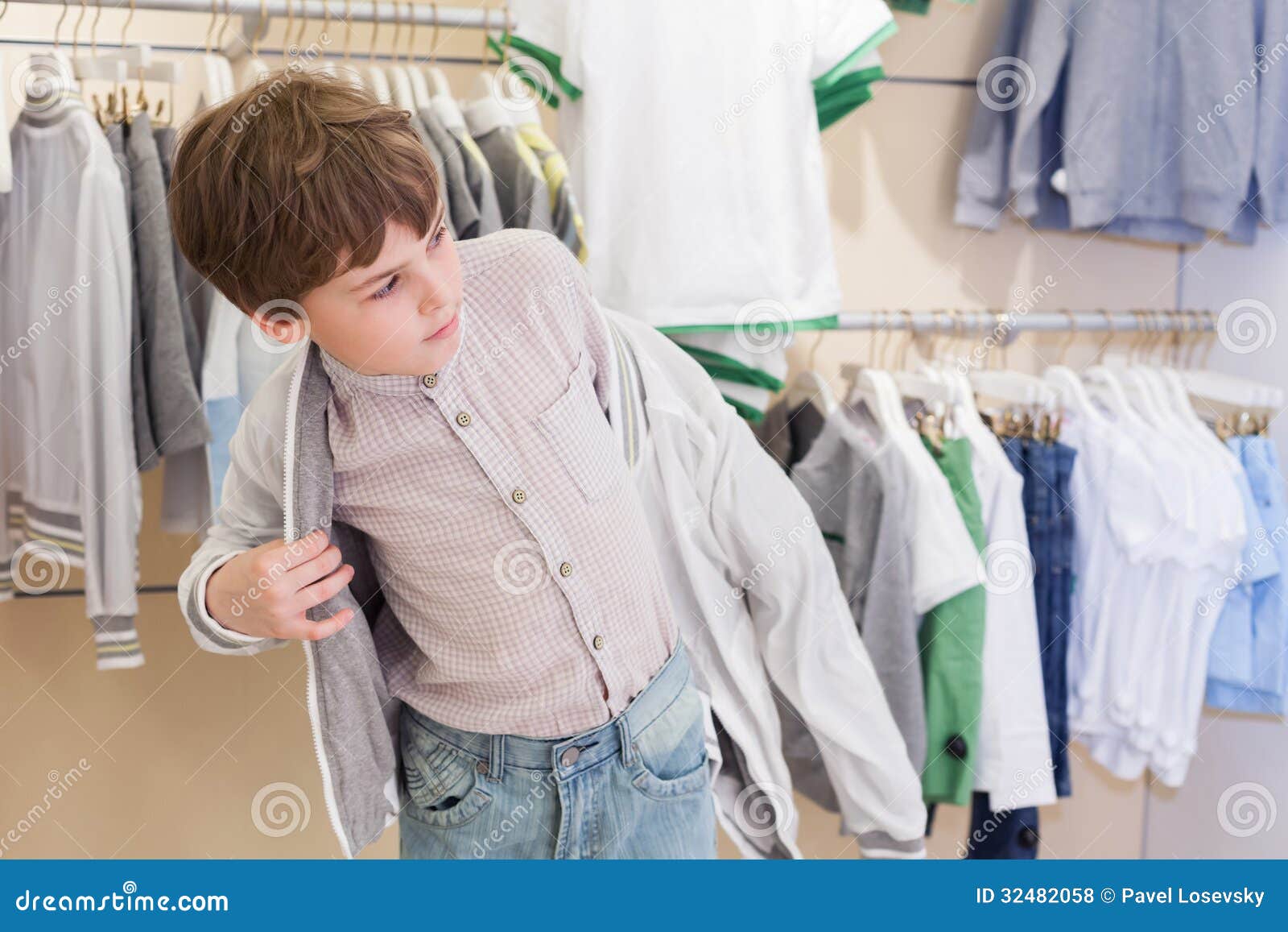 The Boy Tries on Clothes in Store Stock Photo - Image of sale, shopper ...