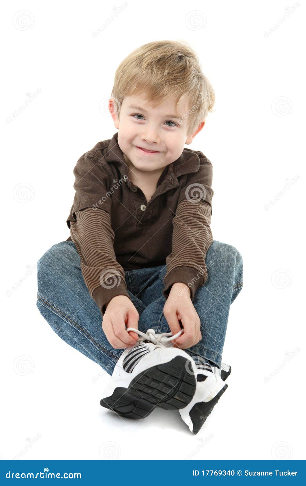 Boy tying his shoes stock photo. Image of learning, practice - 17769340