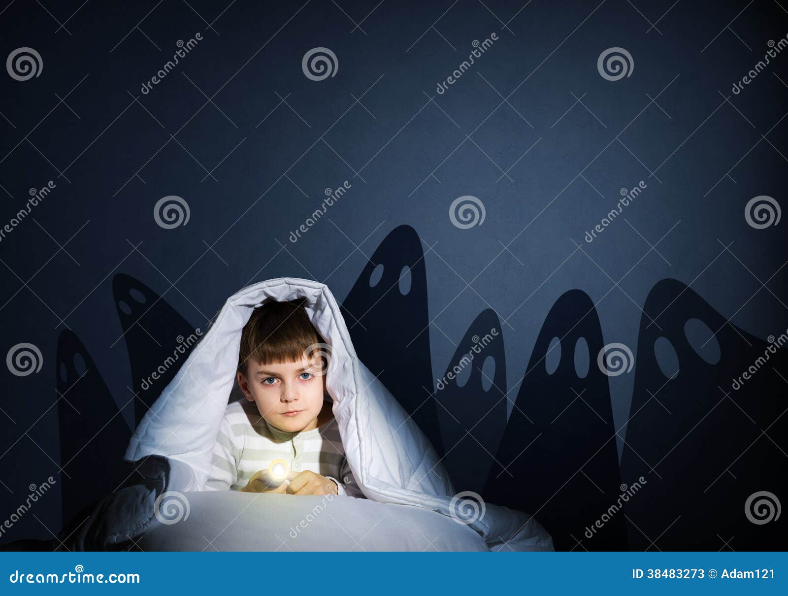 Boy Under the Covers with a Flashlight Stock Image Image of
