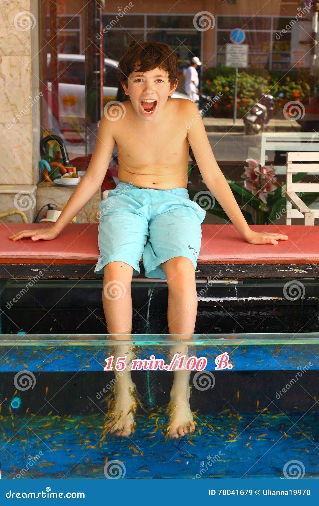 Boy Undergo Fish Pedicure Procedure Stock Image - Image of female, green:  70041679