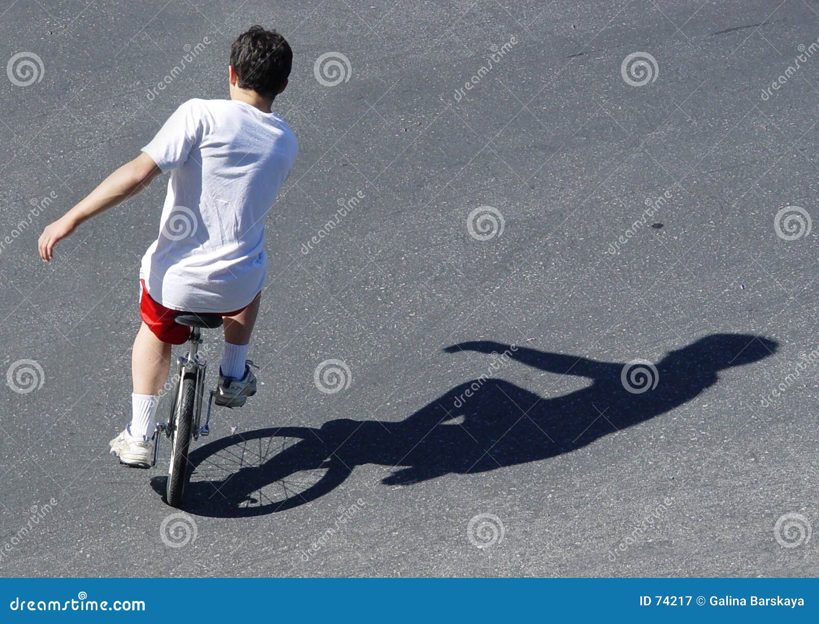 Boy on a unicycle stock image. Image of children, single 74217
