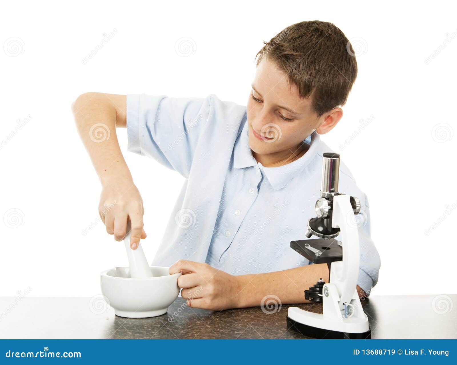 Boy Uses Mortar and Pestle stock image. Image of learning 13688719