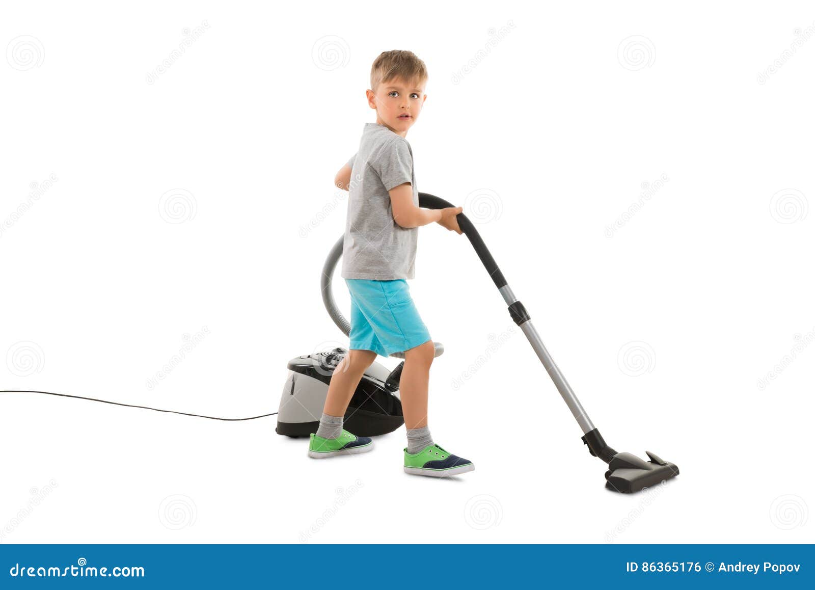 Boy Using Vacuum Cleaner stock photo. Image of service 86365176