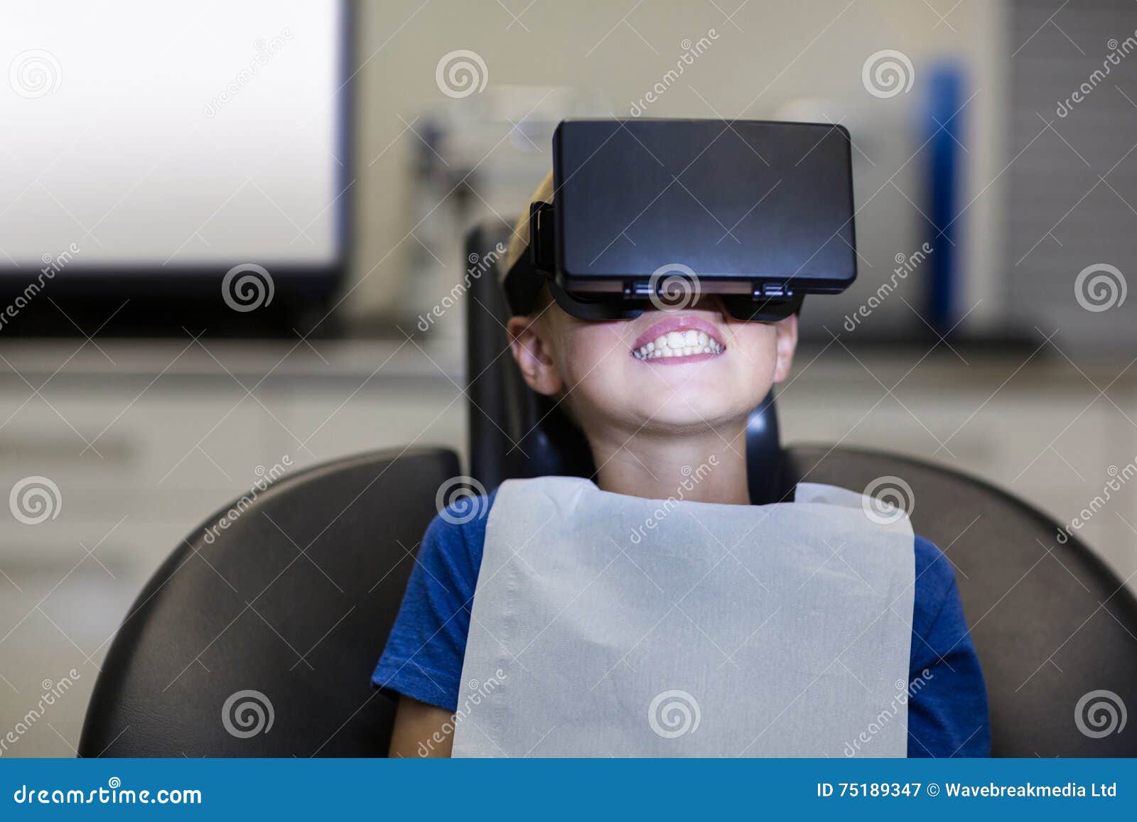 Boy Using Virtual Reality Headset during a Dental Visit Stock Image
