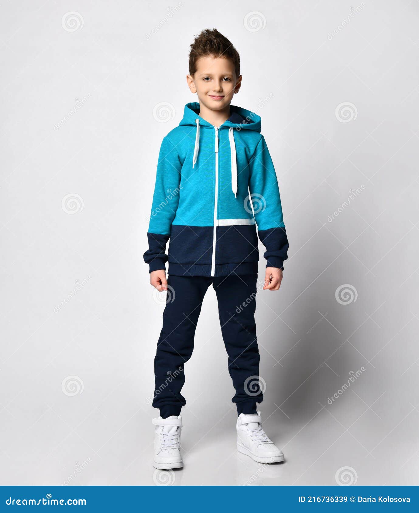 Boy in Warm Sportswear Standing on Studio Stock Image - Image of