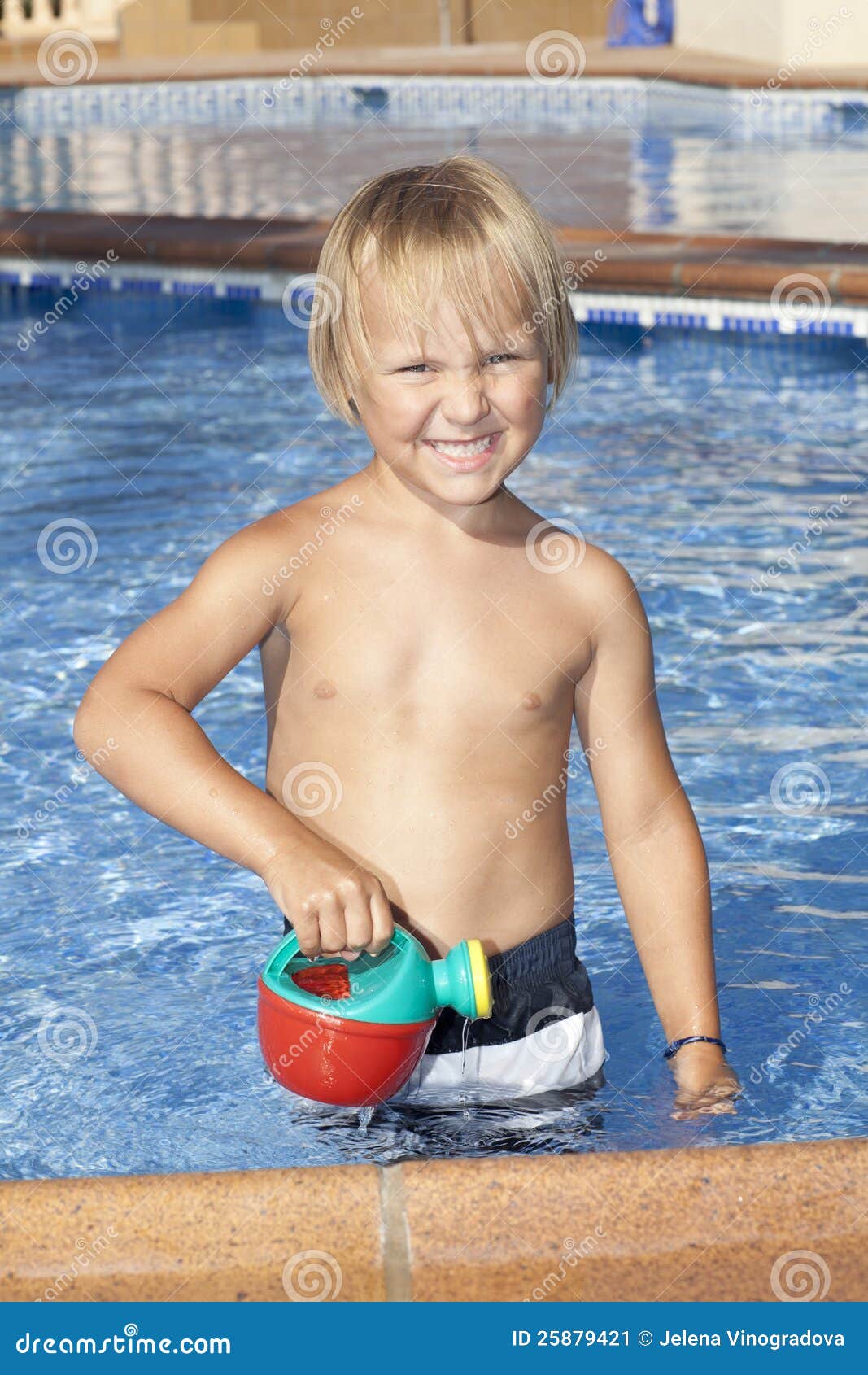 Boy with Watering Can in the Swimming Pool Stock Image Image of