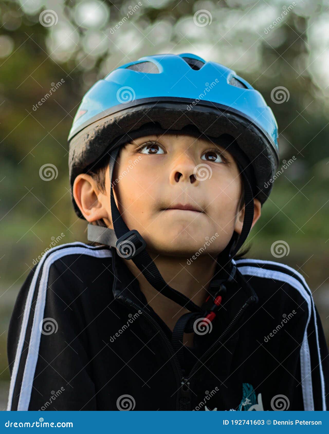 Boy Wearing Blue Helmet Looking Up Stock Image Image of jacket, black 192741603