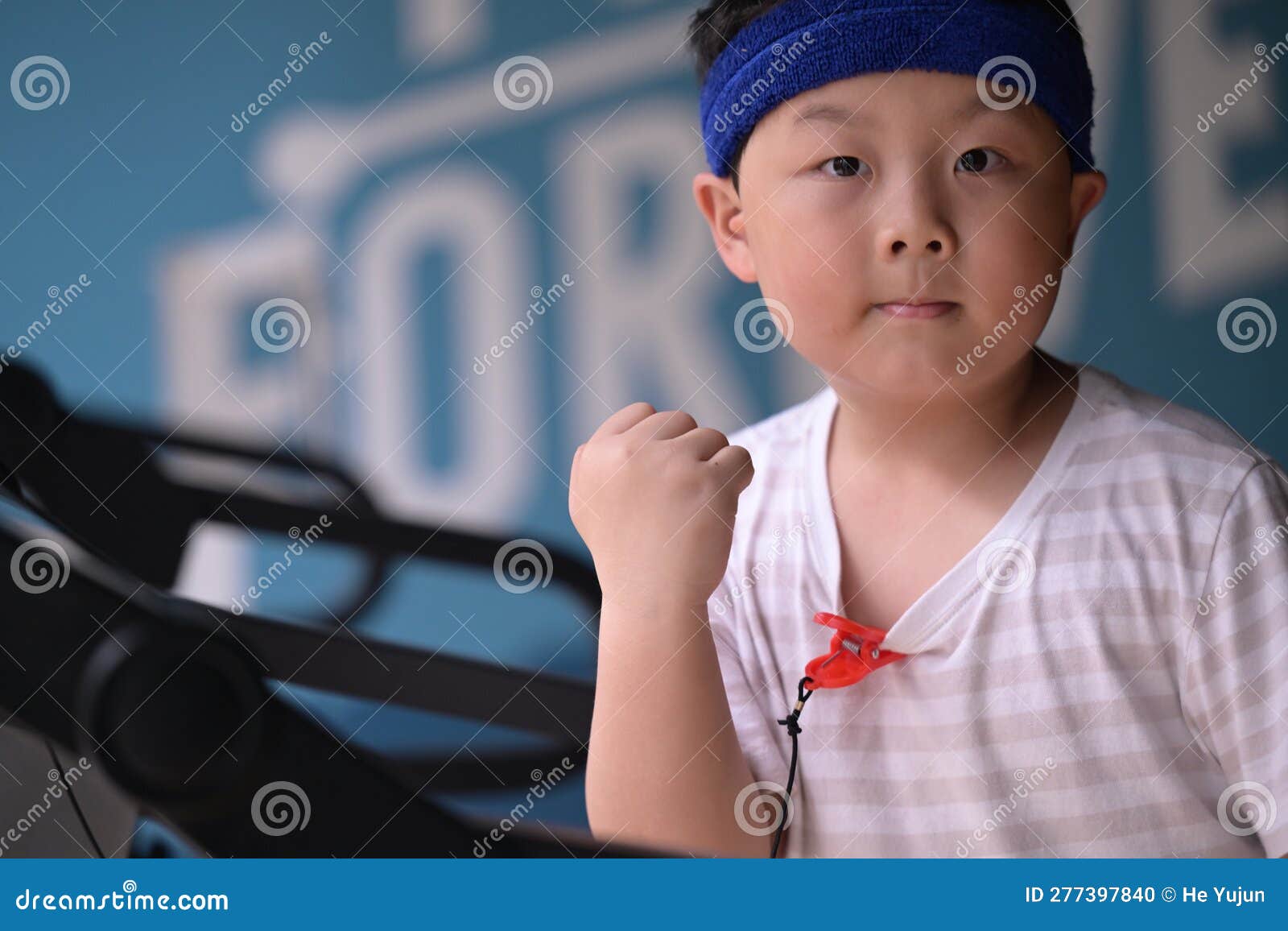 A Boy Wearing a Headband Exercising Stock Photo Image of male, face