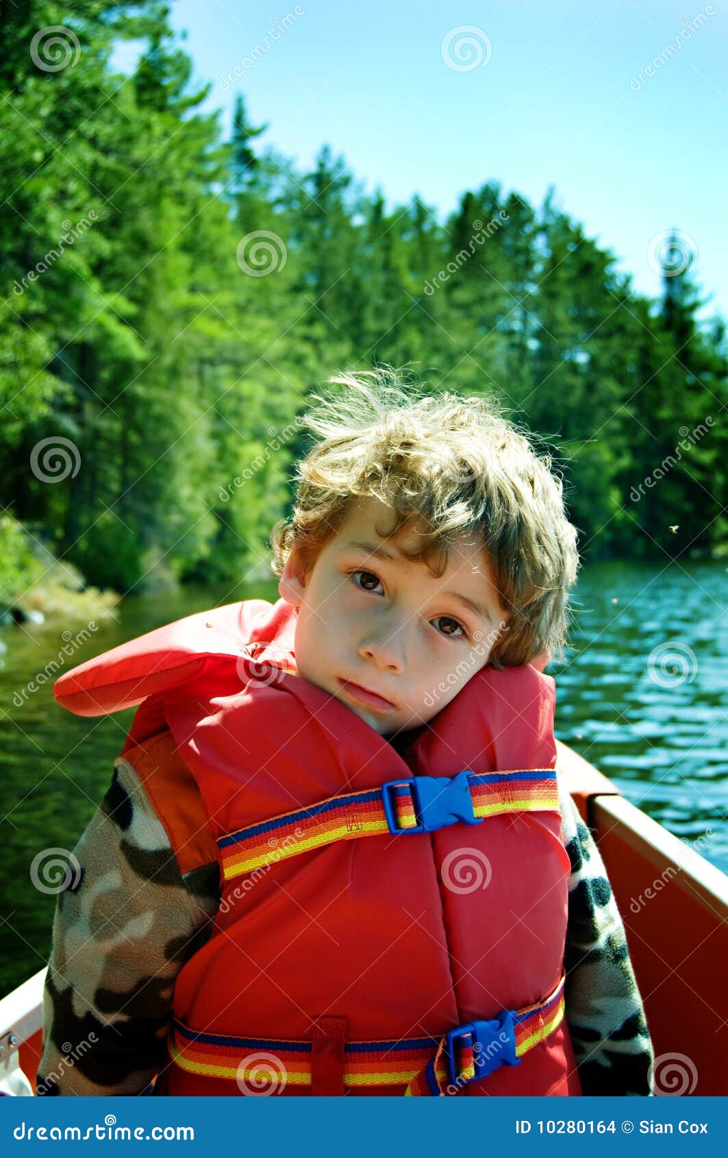 Boy wearing a lifejacket stock photo. Image of outdoors 10280164