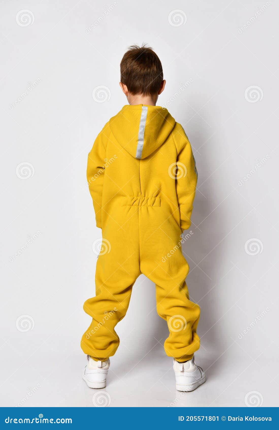 Boy Wearing Yellow Jumpsuit Back View Studio Shot Stock Image - Image ...