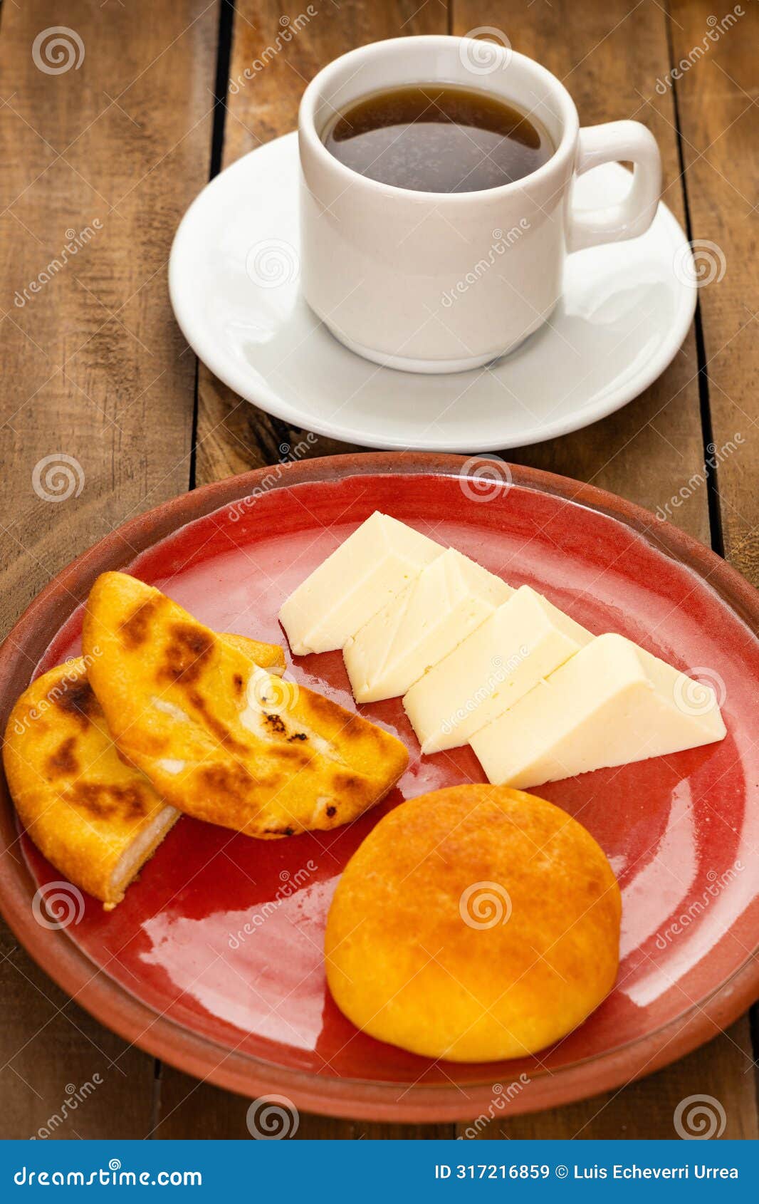 boyacense arepa for breakfast, accompanied with cheese, almojabana and aguapanela
