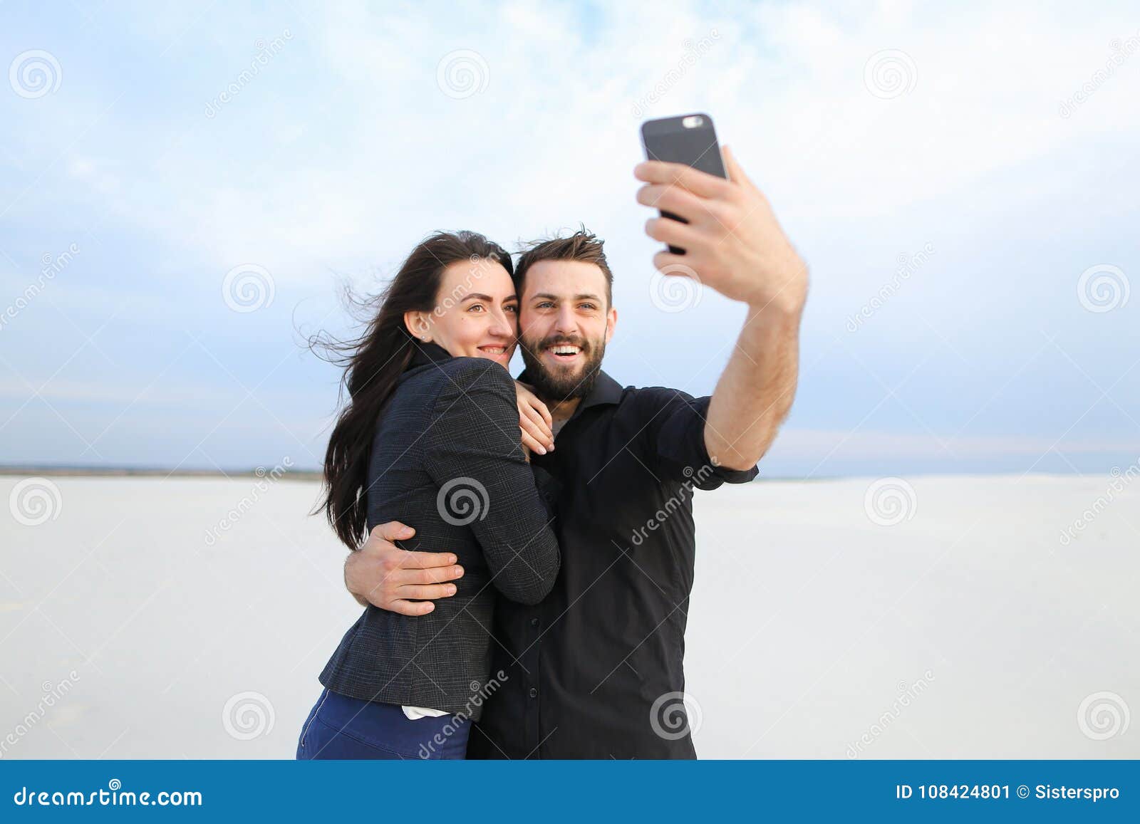Dark-haired handsome boyfriend posing for selfie with his appealing  girlfriend Stock Photo - Alamy