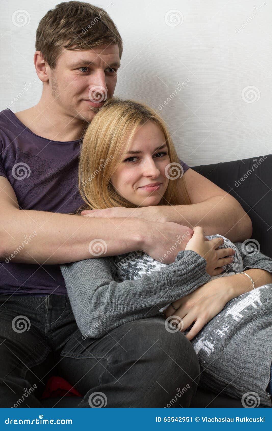Boyfriend Hugging His Girlfriend on the Couch. Stock Image Image of