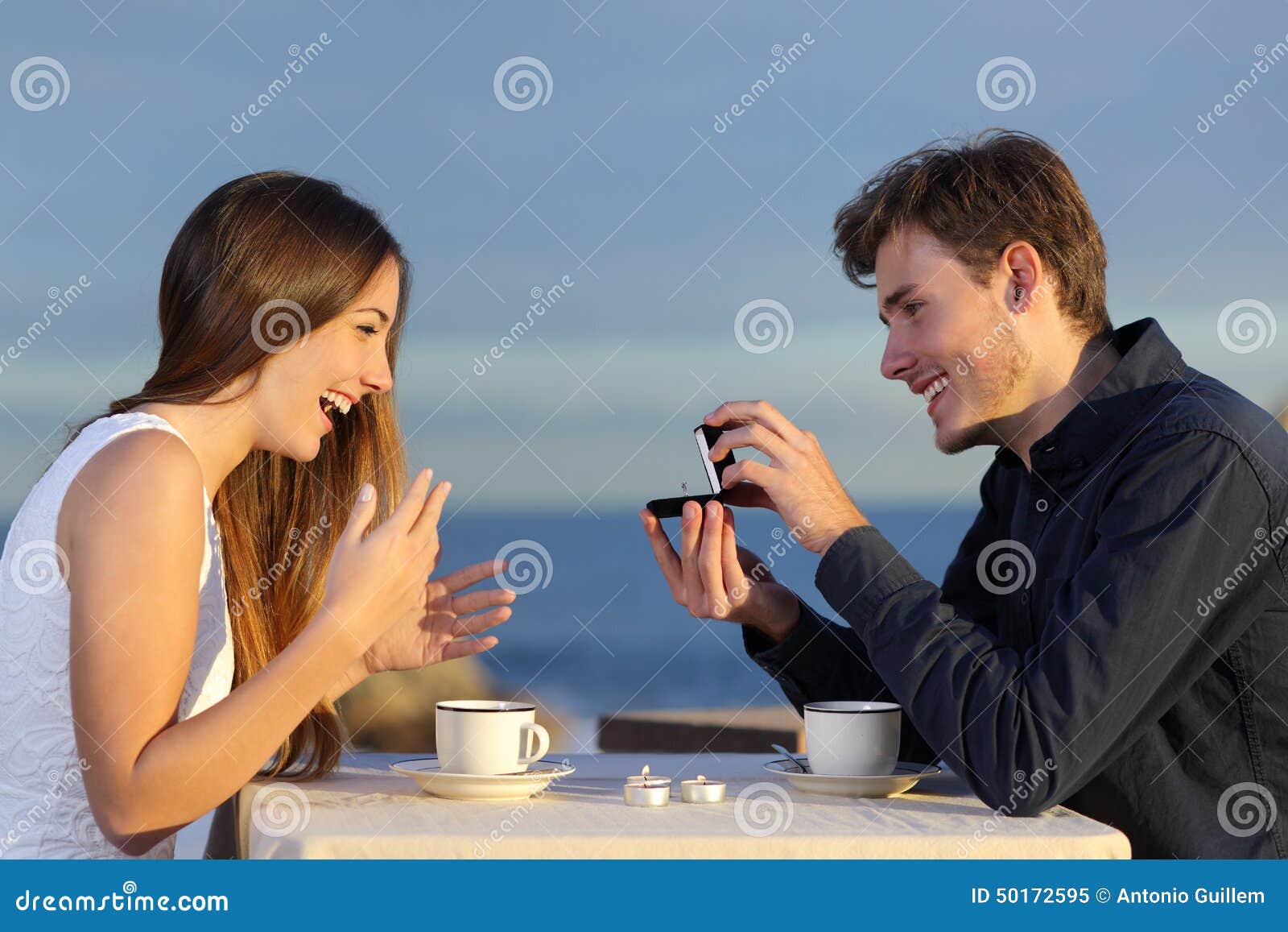 boyfriend requesting hand of his girlfriend with a engagement ring