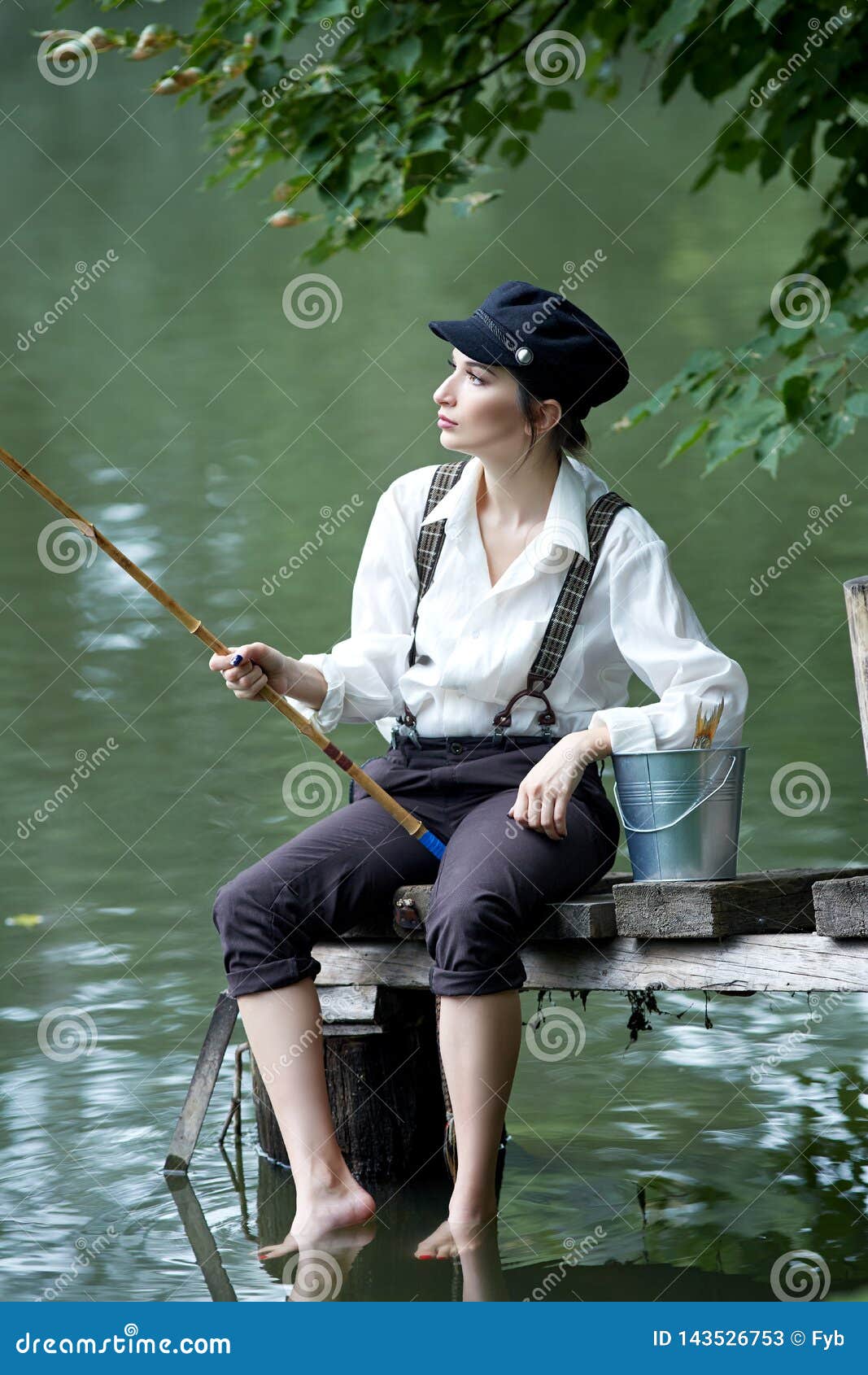 boyish looking girl fishing outdoors