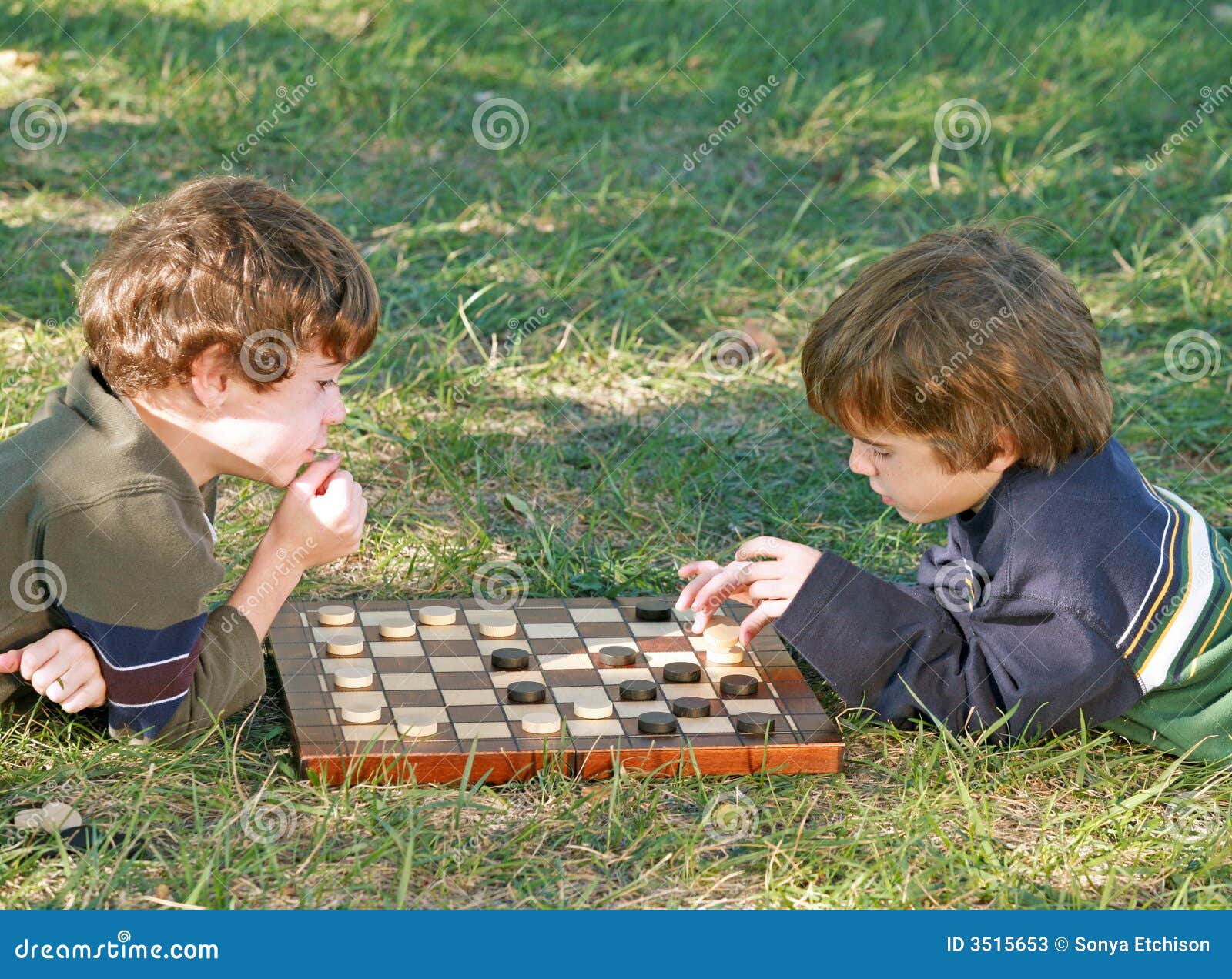boys playing checkers