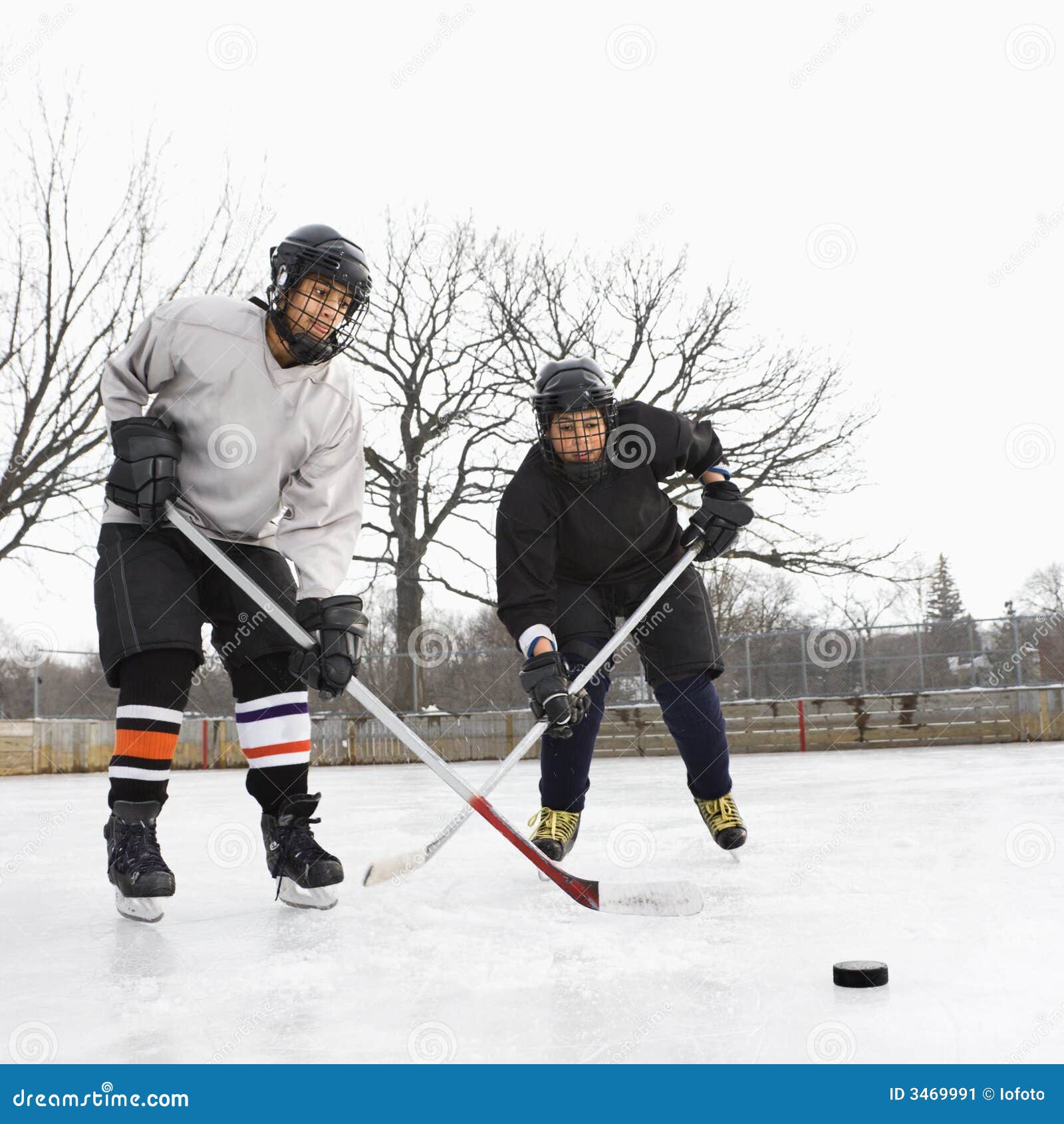 Boys playing ice hockey. stock image. Image of multiethnic 3469991