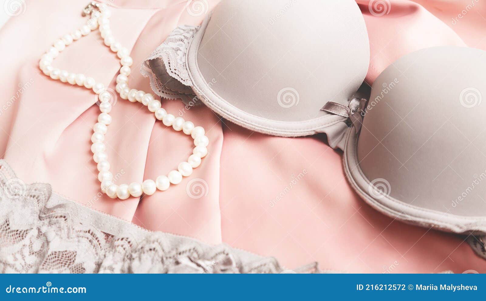 Women`s Fashion Underwear.bra Lying Down on Silk Satin Background