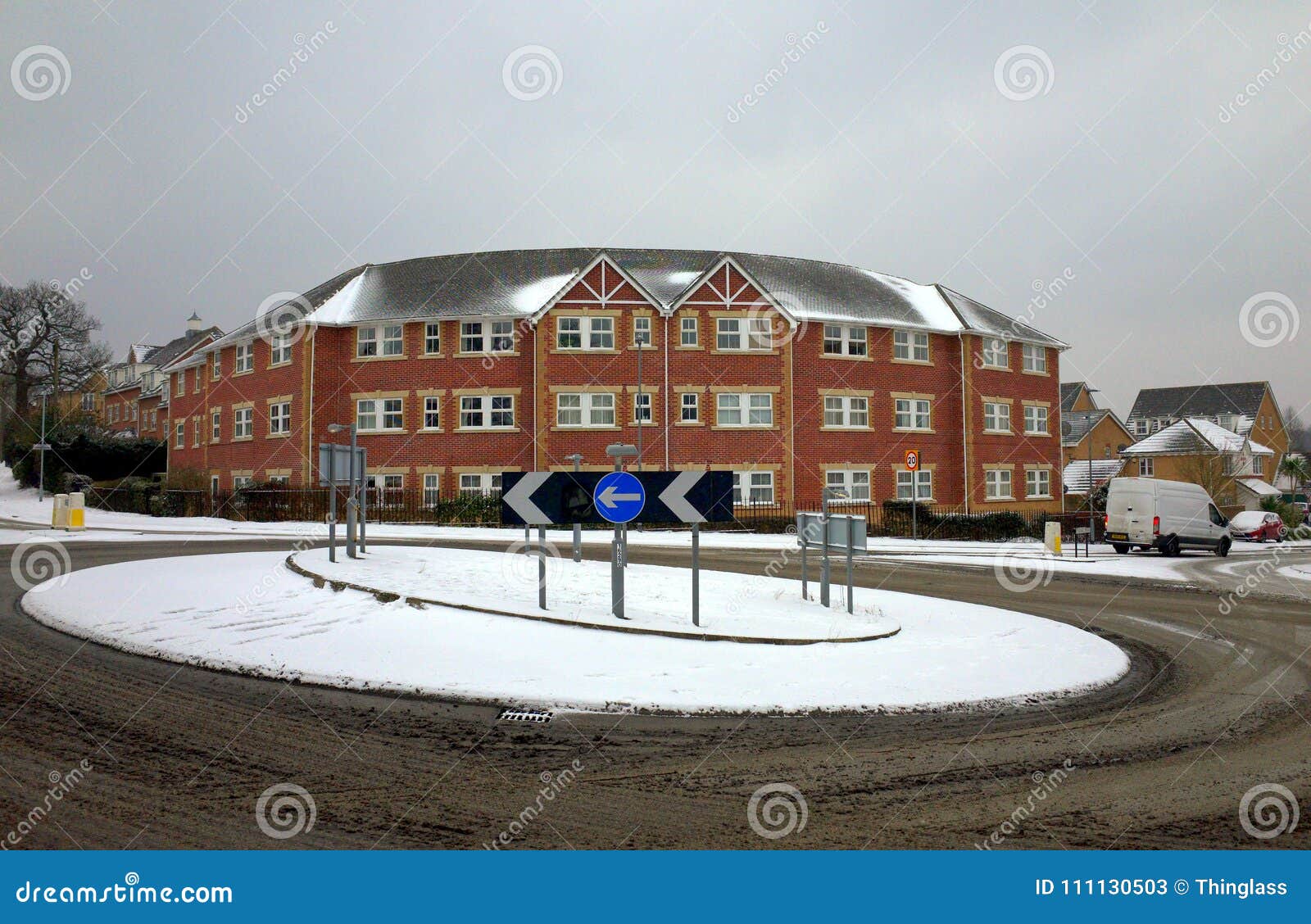 bracknell-england-march-snow-covered-roundabout-surrounded-dirty-melted-slush-front-modern-apartment-block-111130503.jpg