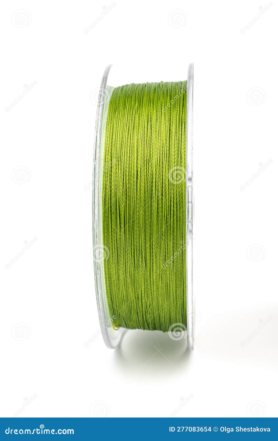 Braided Green Line for Fishing on a Transparent Coil, Isolate