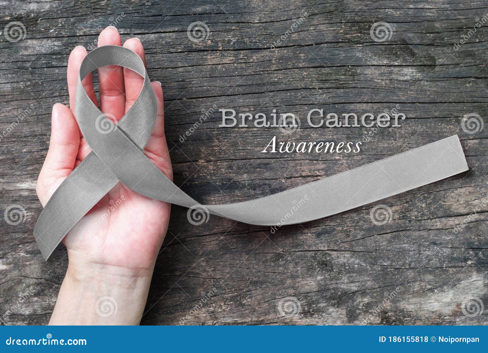 Brain Cancer Awareness Grey Ribbon On Helping Hand Stock Photo Image