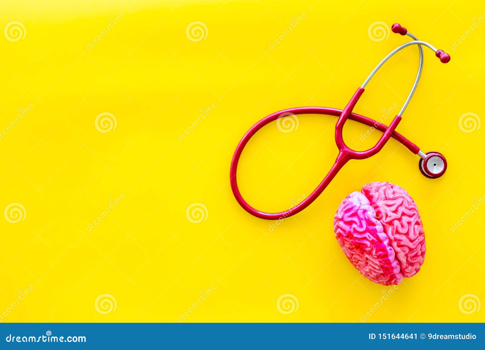 brain functions concept with brain and stethoscope on yellow background top view space for text