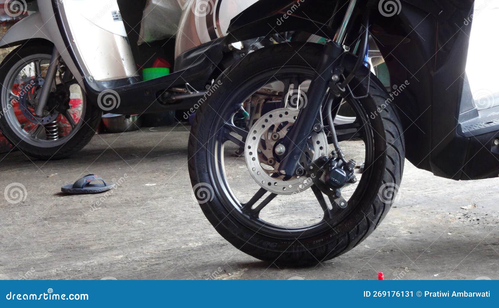 Brake Pad Replacement Service for Motorcycle Disc Brakes Stock Image