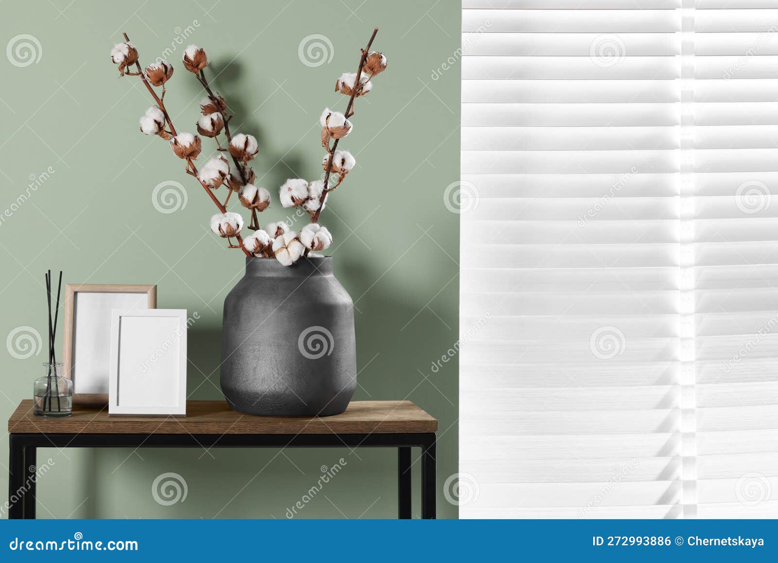 Branches with White Fluffy Cotton Flowers on Console Table in Cozy Room