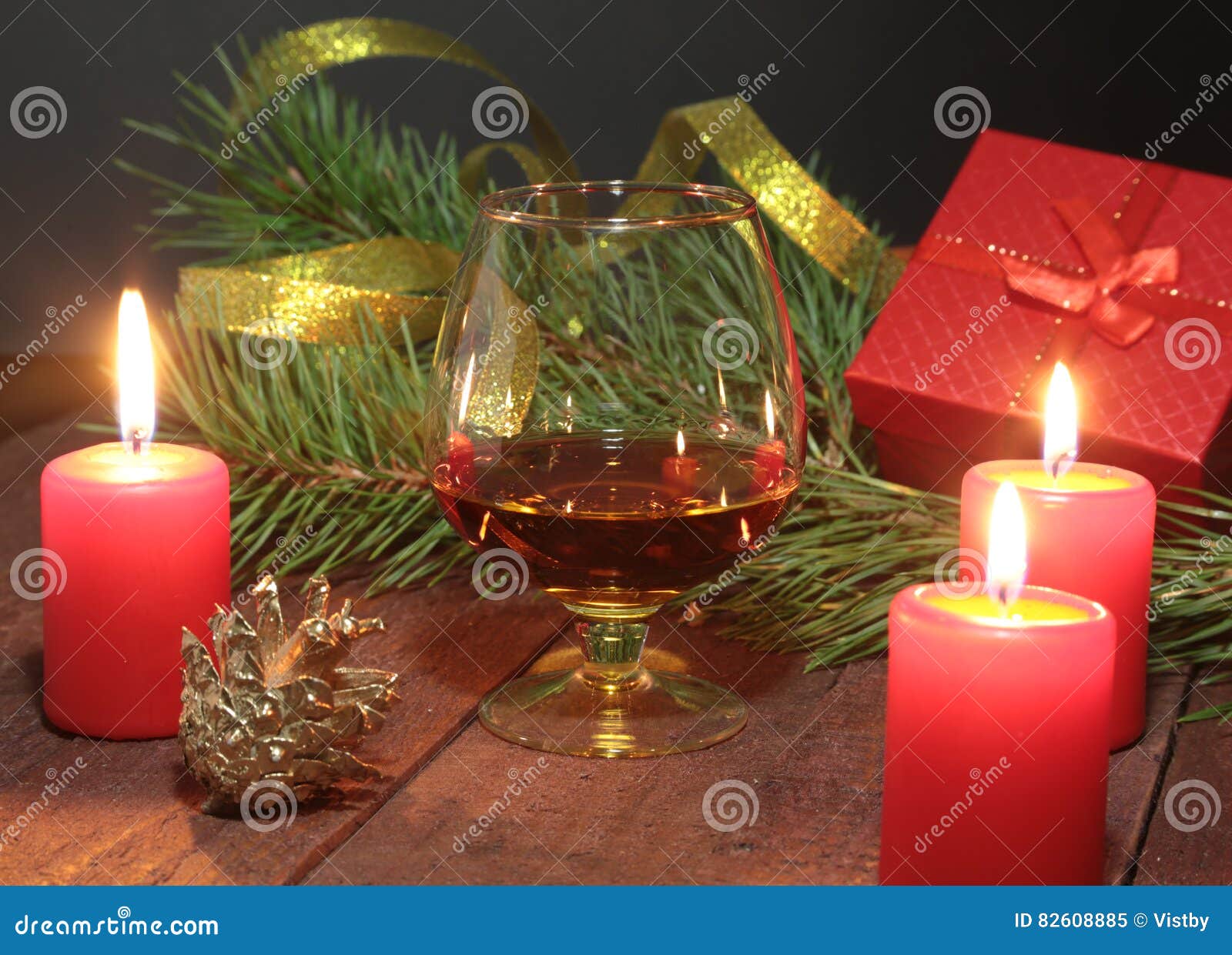 Brandy Glass and Candles on Black Background Stock Image Image of