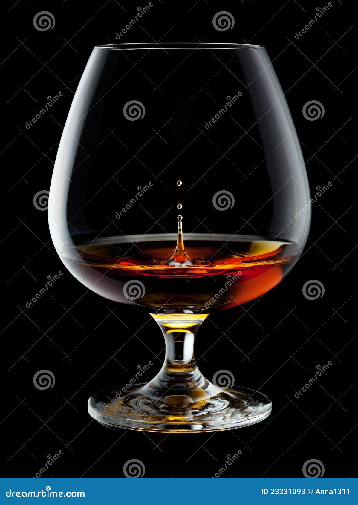 brandy glass with drops and splash on black