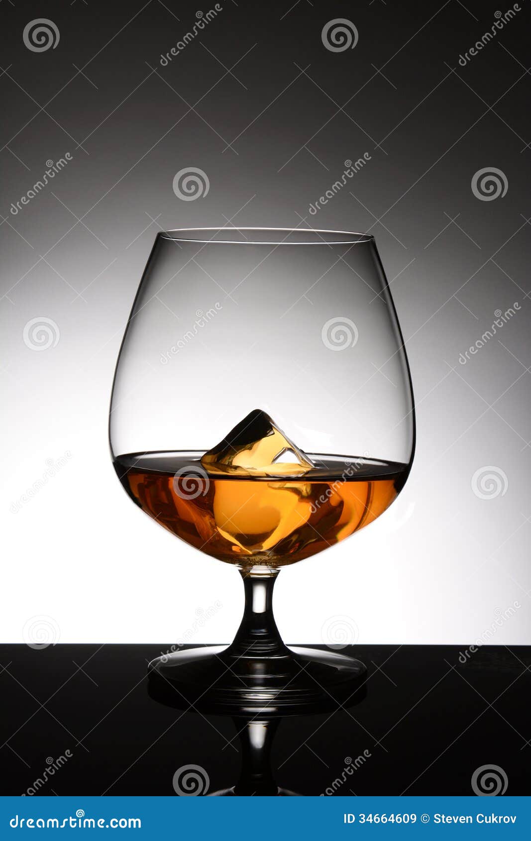 Brandy Snifter With Ice Cube Stock Image Image of dark, brandy 34664609