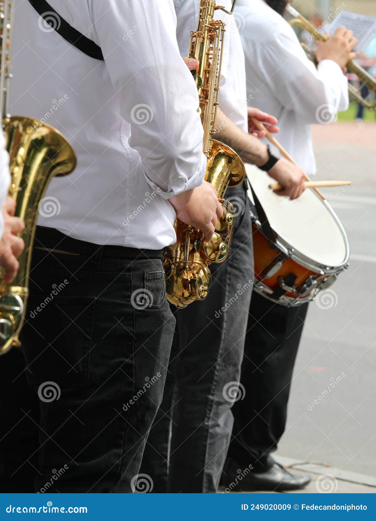 Brass Band with Players while Playing Saxophone and Drum Stock Image