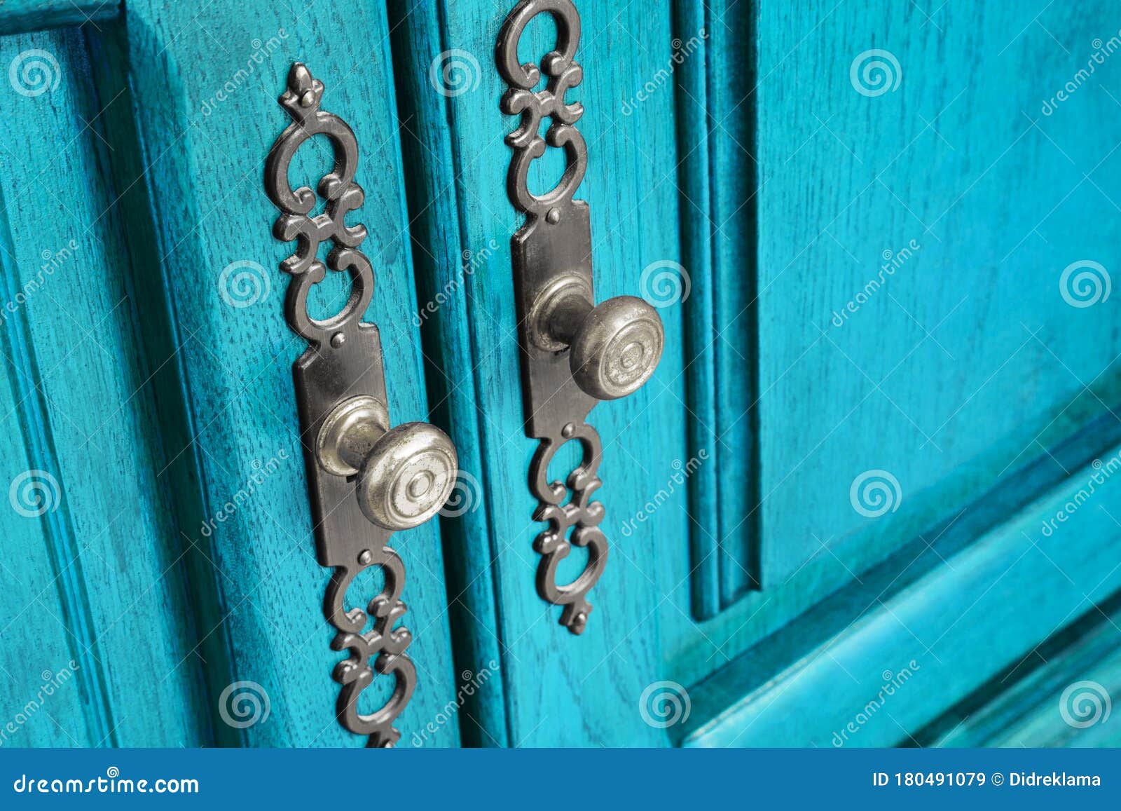 brass door handles with ornate escutcheons