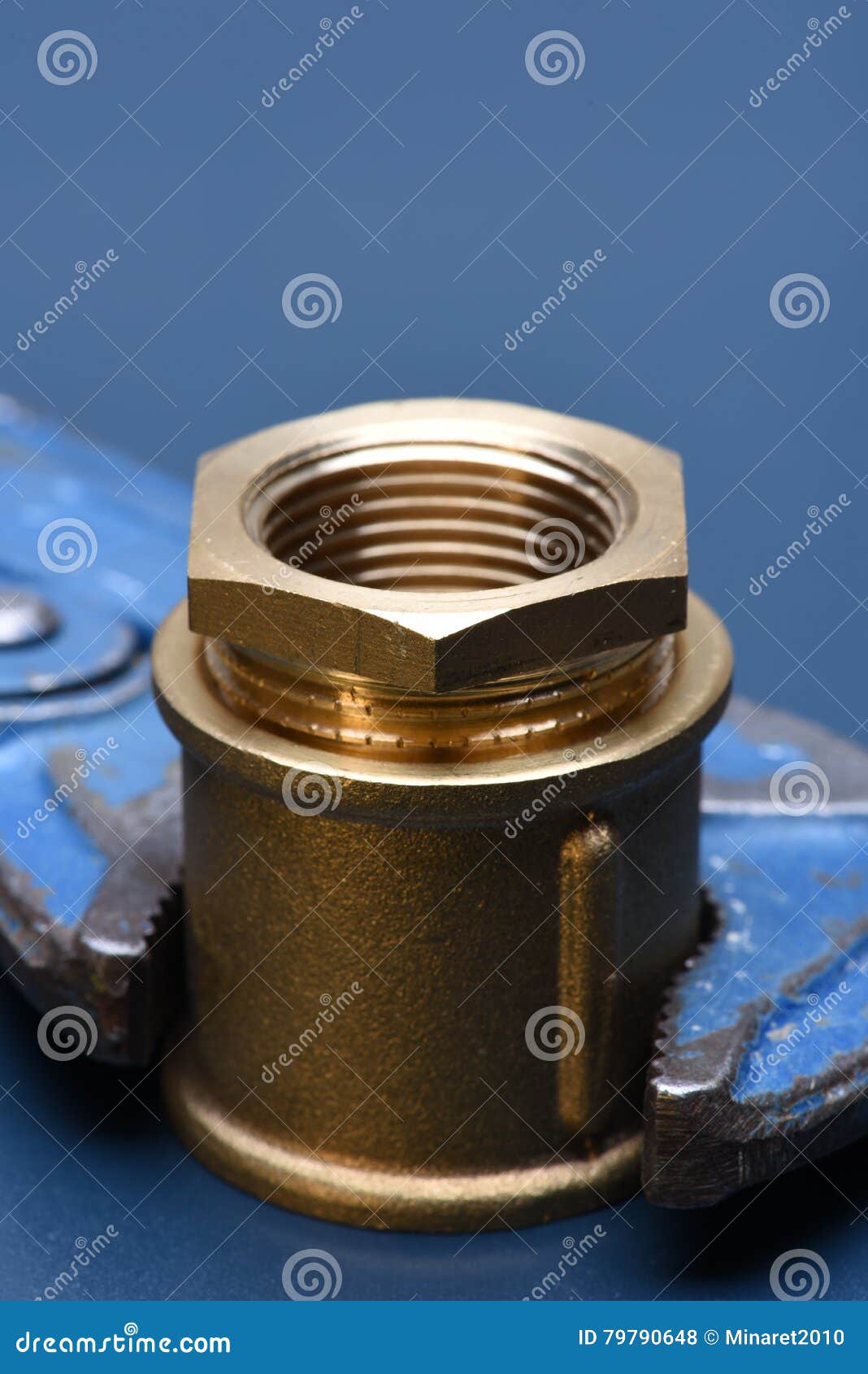 Brass fittings and wrench stock photo. Image of connector 79790648