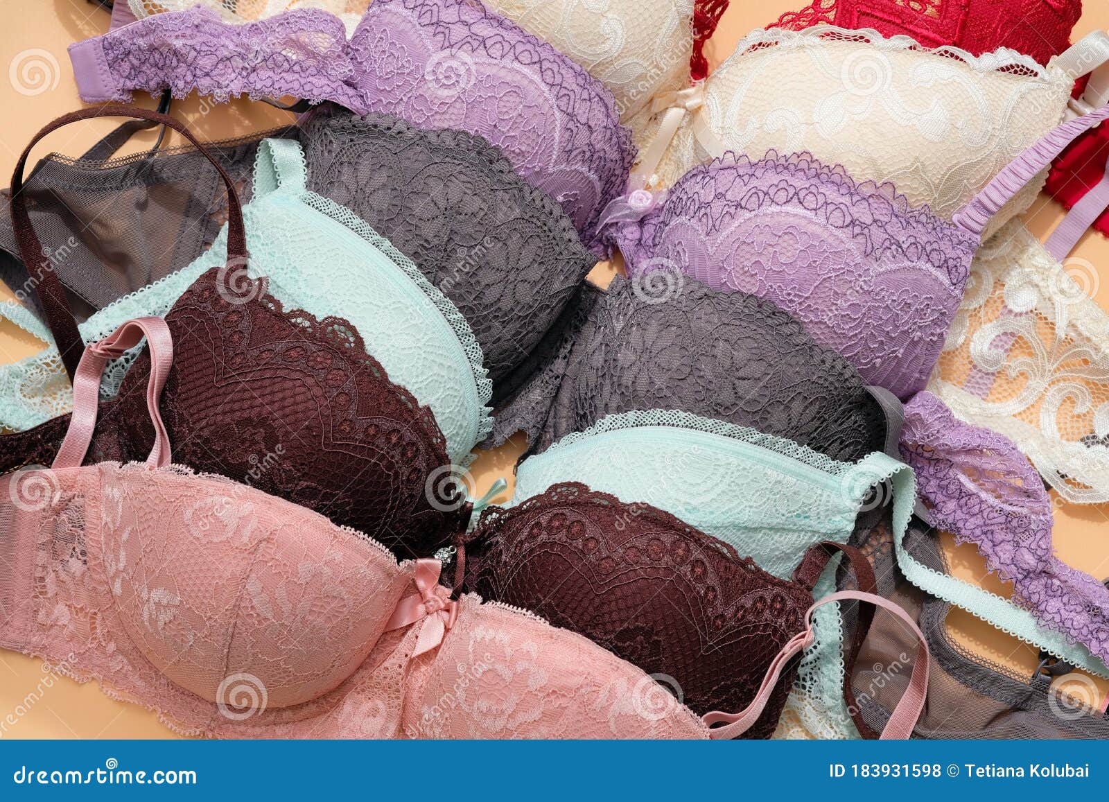 Brassieres of Different Colors are Folded in a Dresser. Stock