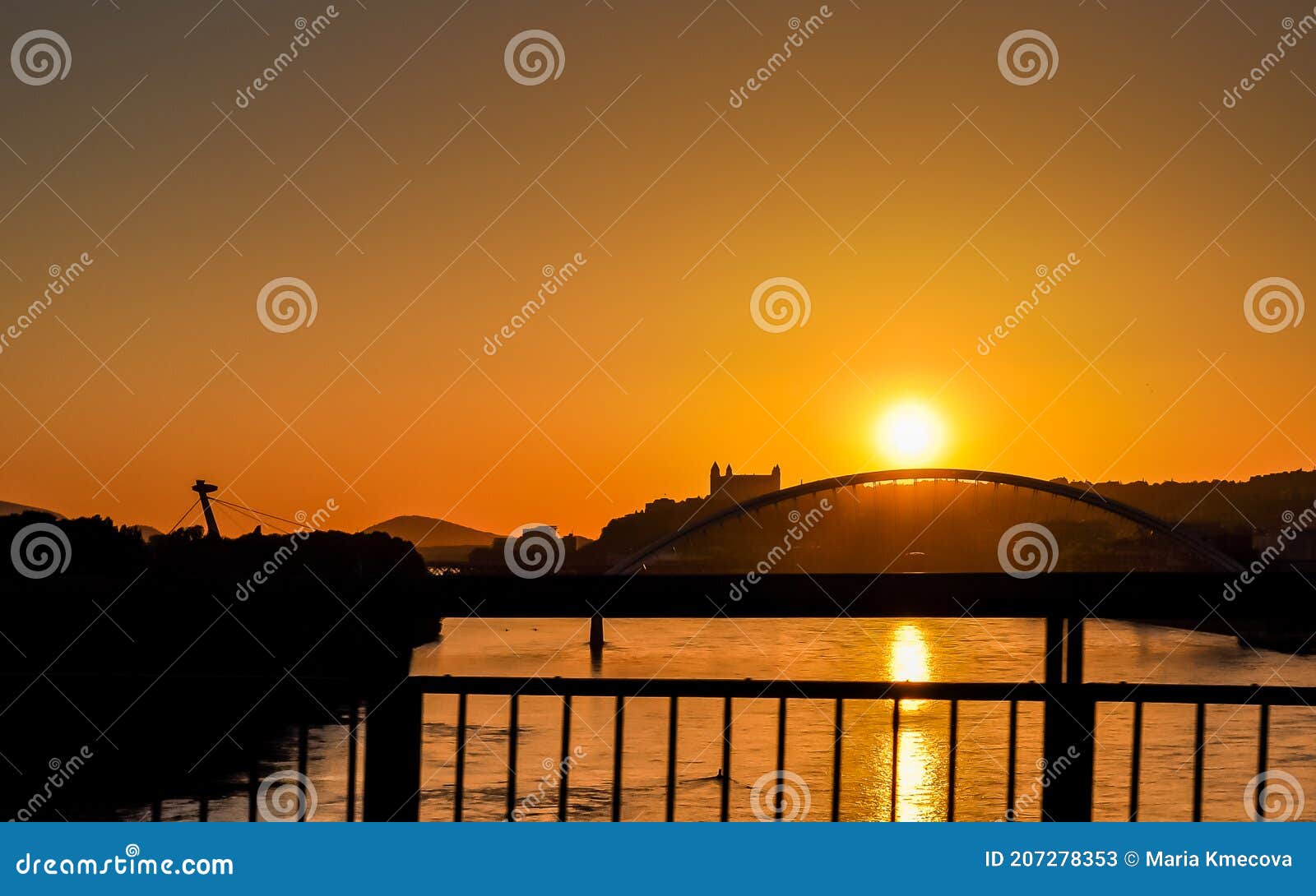 bratislava beautiful sunset view with the apollo bridge, bratislava castle and snp bridge.