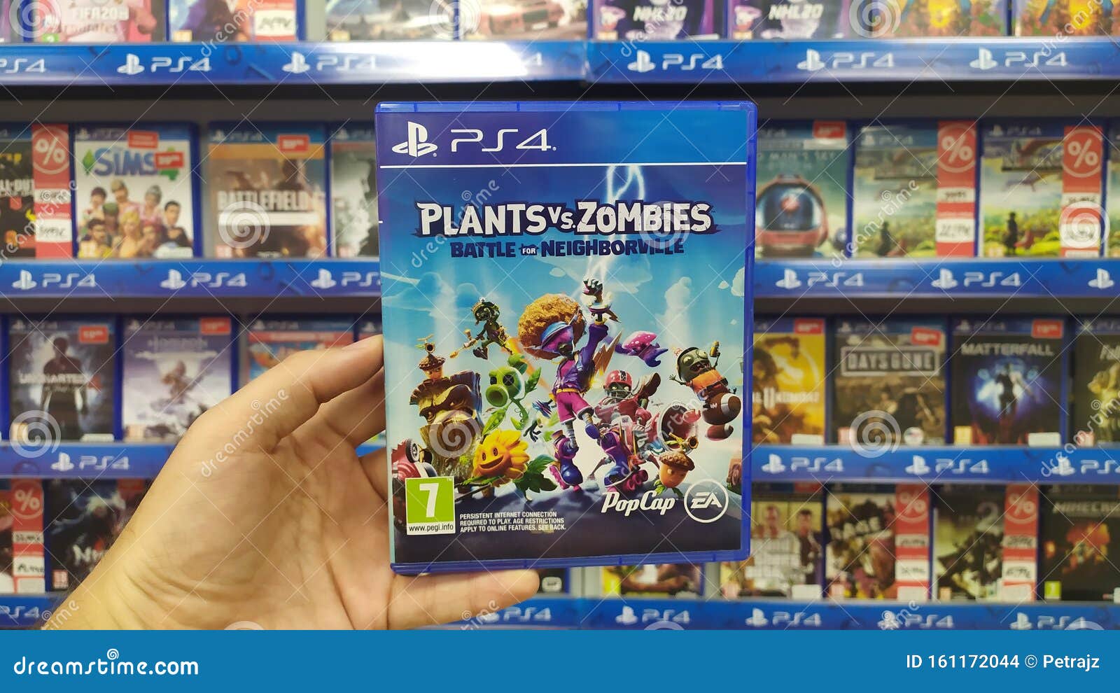 Man Holding Vs Zombies: Battle for Neighborville Videogame on Sony Playstation 4 Console in Store Editorial Stock Image - Image of battle, controller: 161172044