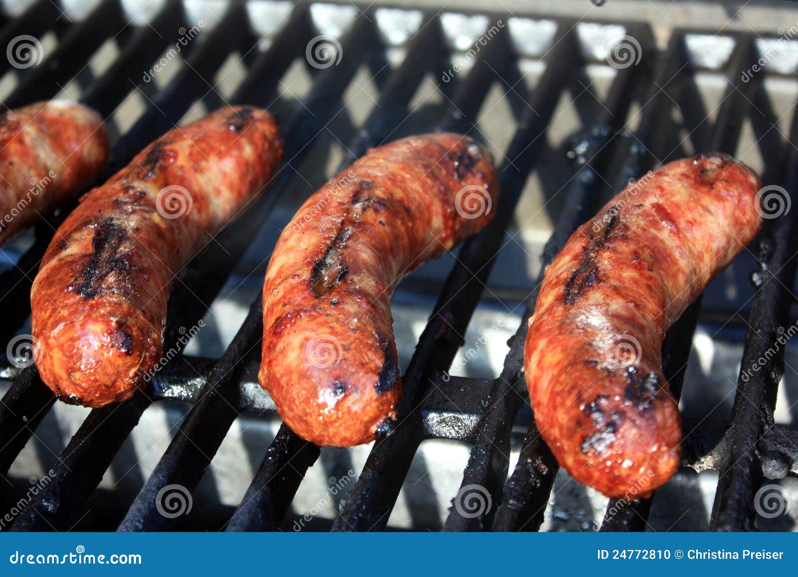 Brats Cooking on the Grill stock photo. Image of brats 24772810
